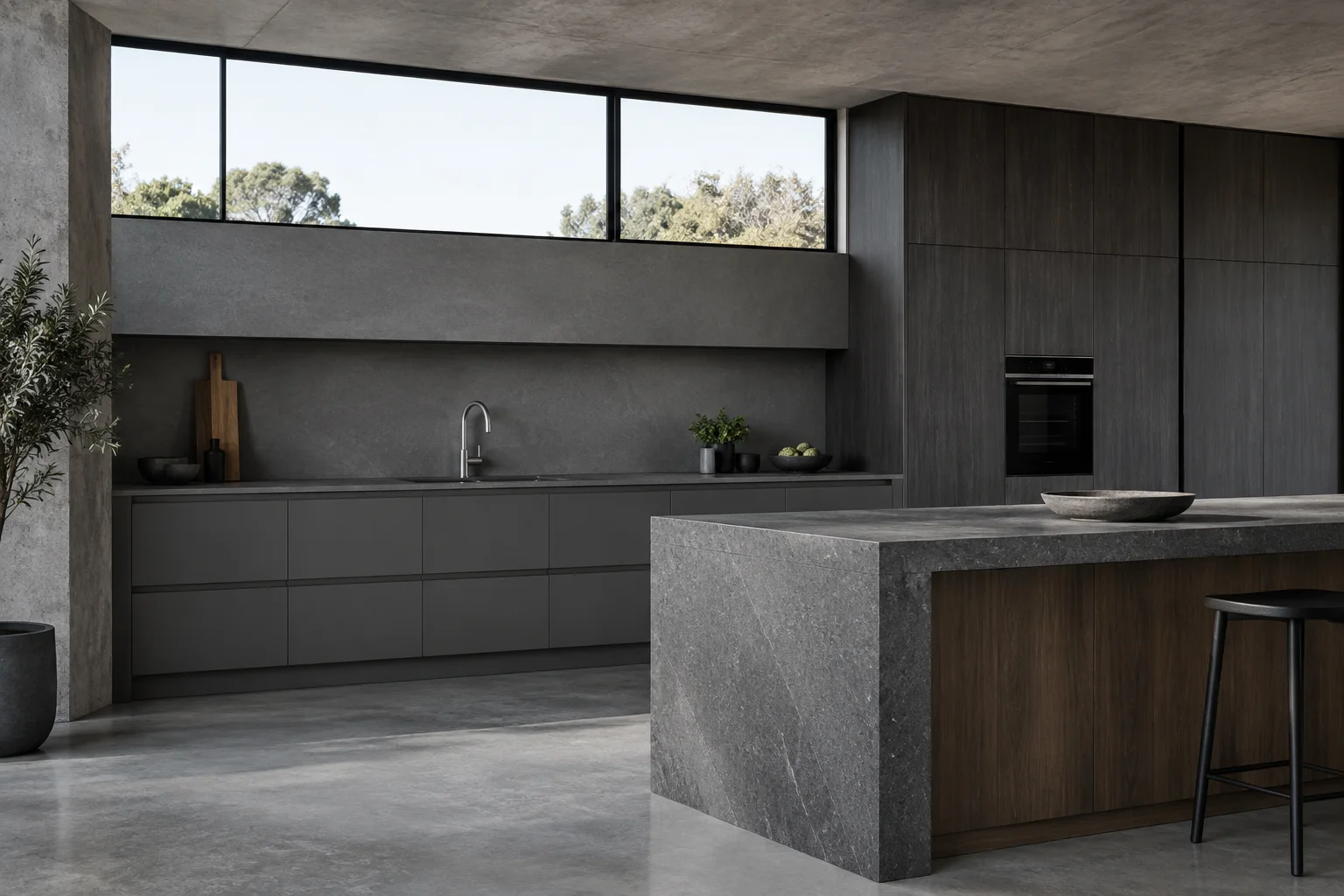 Slate grey cabinetry, dark timber tall units and a stone island — design concept