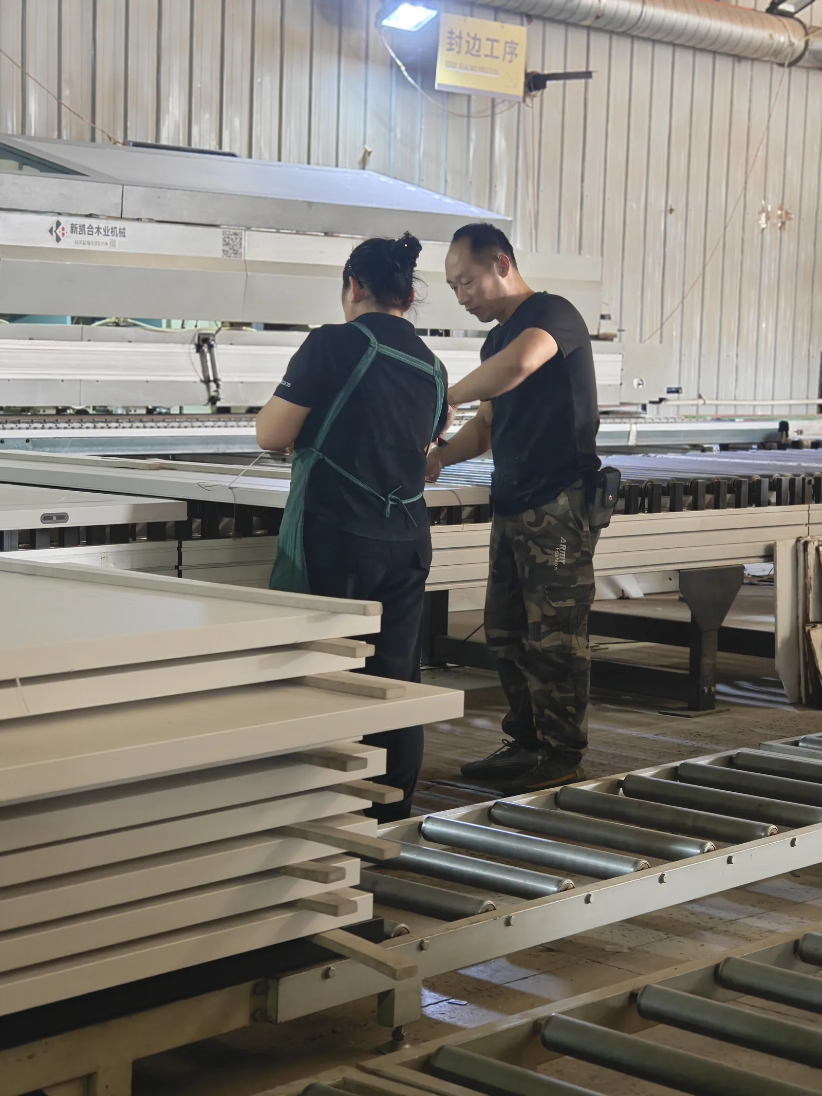 SNEJ production team coordinating panel processing in the Xinmin factory