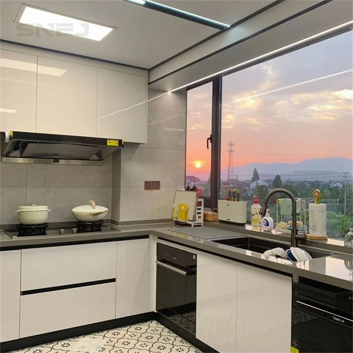 White kitchen base cabinets beneath a wide window - Modern Kitchen Hutch Cabinets by SNEJ