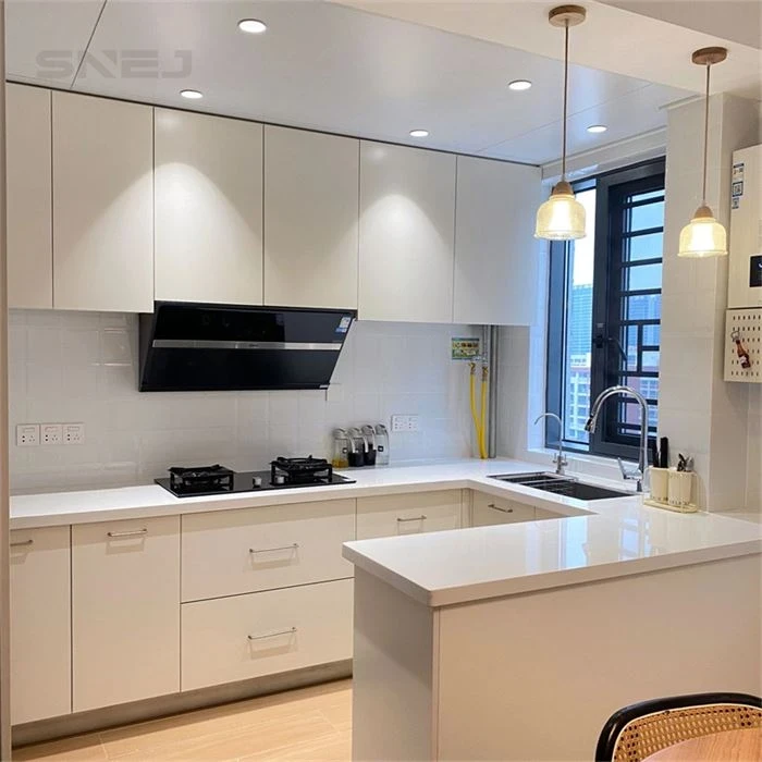 Pale kitchen cabinets with a peninsula and black extractor hood - Modern Traditional Kitchen Cabinets by SNEJ