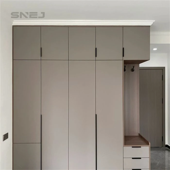 Fitted wardrobe with overhead cupboards beside an entry bench - Innovative Closet Doors by SNEJ
