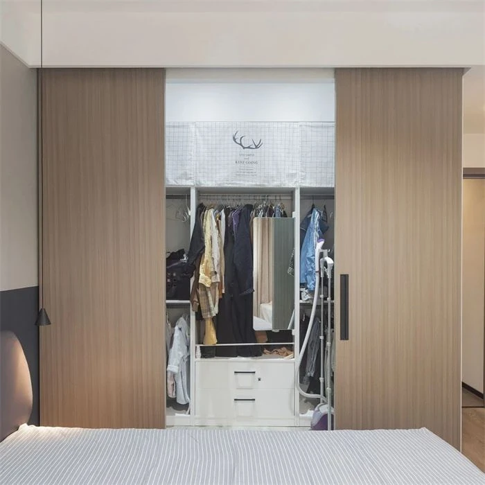 Wardrobe with wood-tone panels opening onto clothing storage - Sliding Wardrobe 4 Doors by SNEJ, image 3