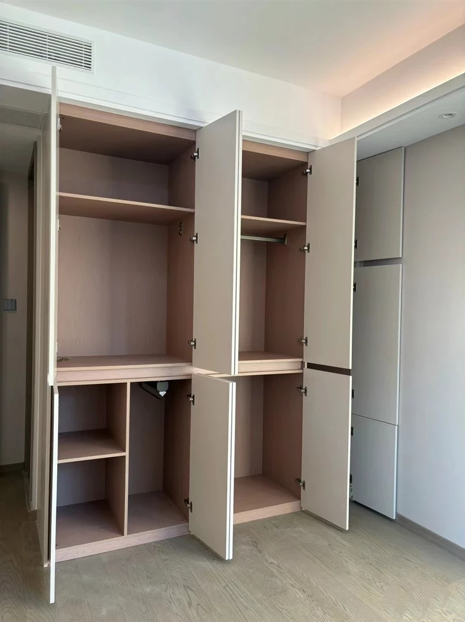 Open wardrobe interior showing hanging rails, shelves and lower storage - Sectional Bedroom Closet by SNEJ, image 3