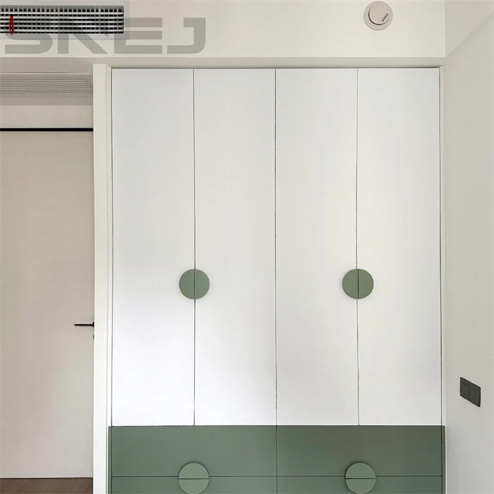 White wardrobe with round handles and green lower drawers - Cute Closet Doors by SNEJ