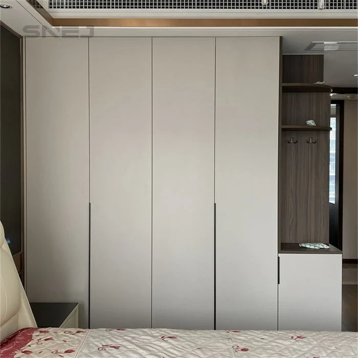 Full-height pale wardrobe doors beside a dressing area - Tall Open Wardrobe by SNEJ