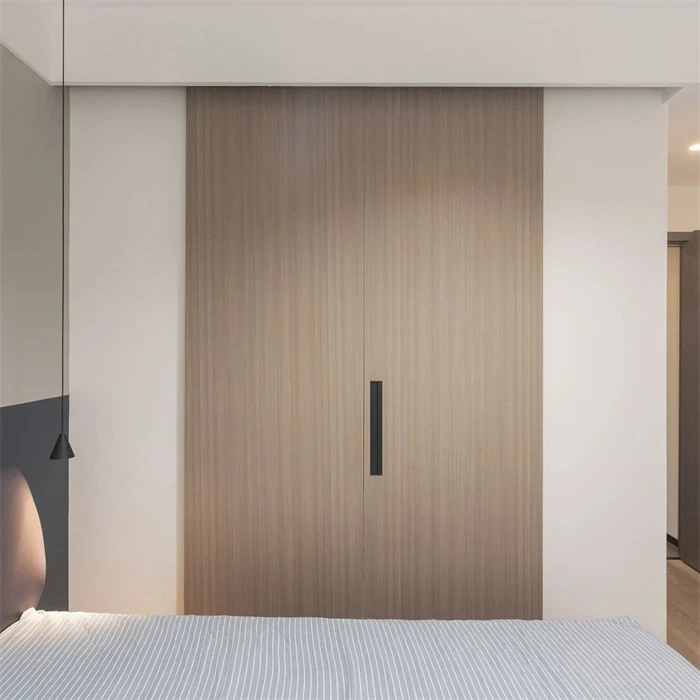 Wood-grain wardrobe doors with a dark recessed handle - Sliding Wardrobe 4 Doors by SNEJ