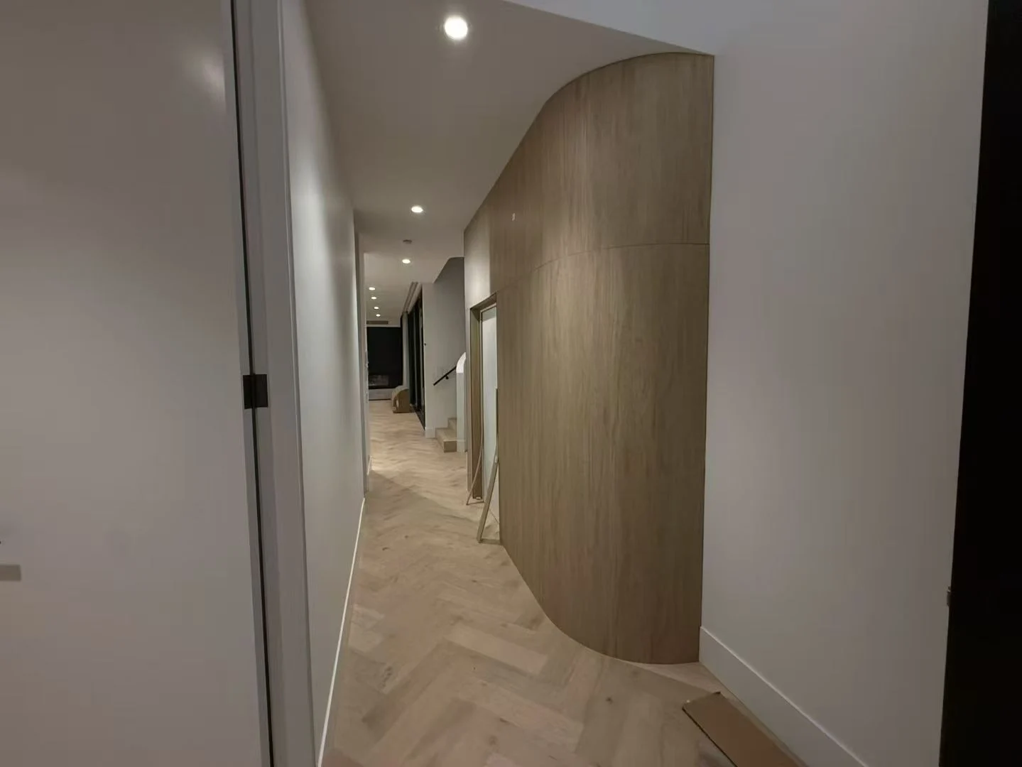 Hallway with full-height doors and fitted joinery