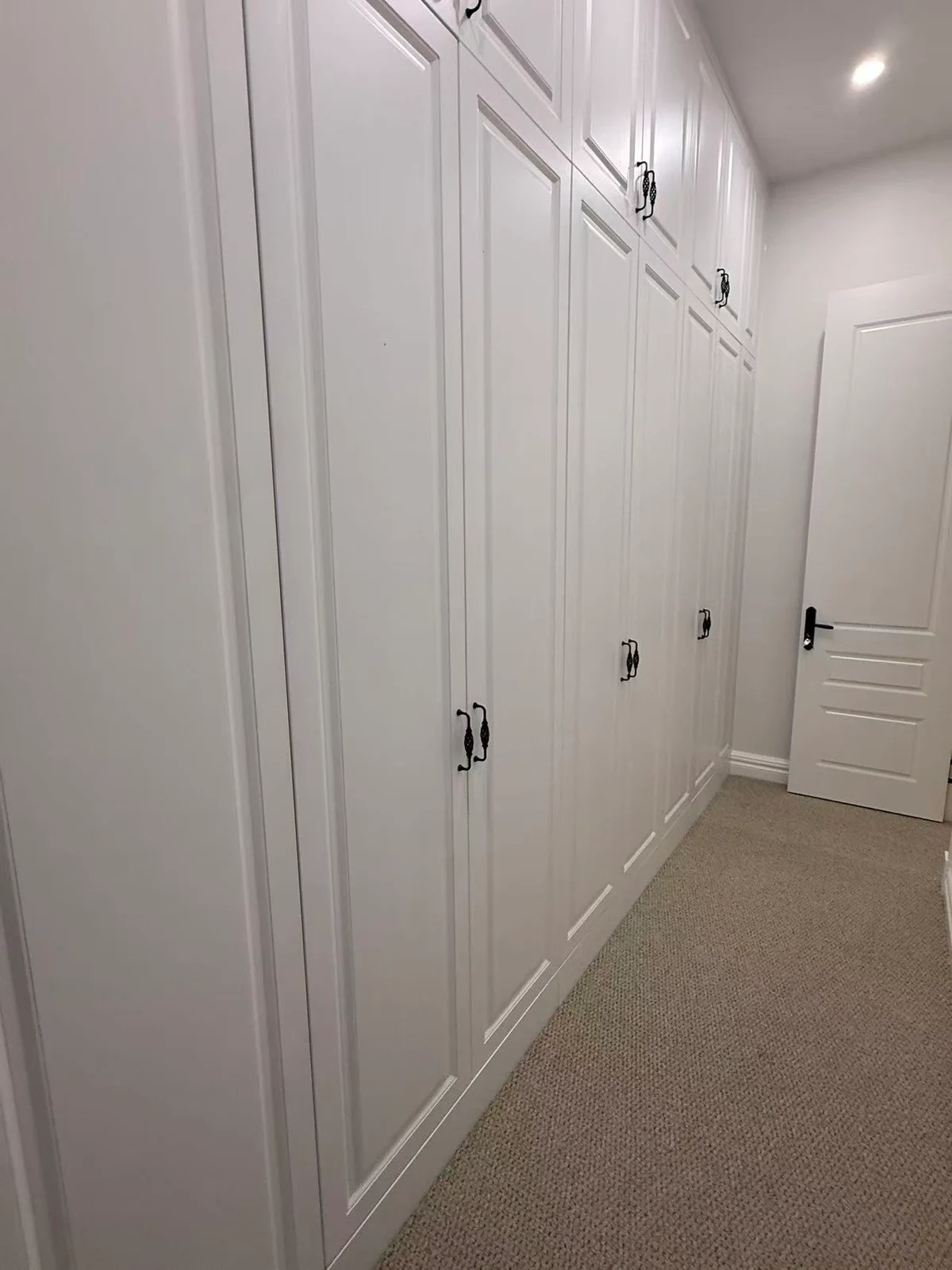 Full-height painted wardrobe fronts