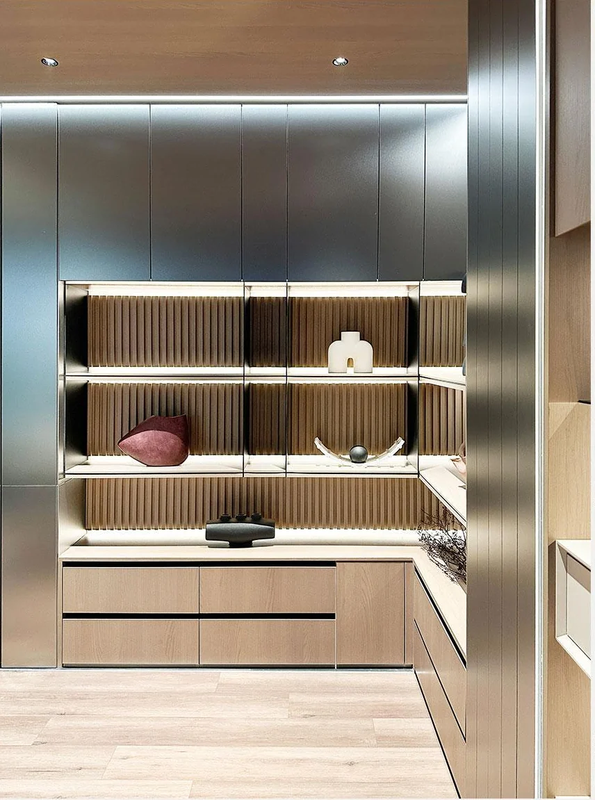 Walk-in storage with illuminated shelving and drawers