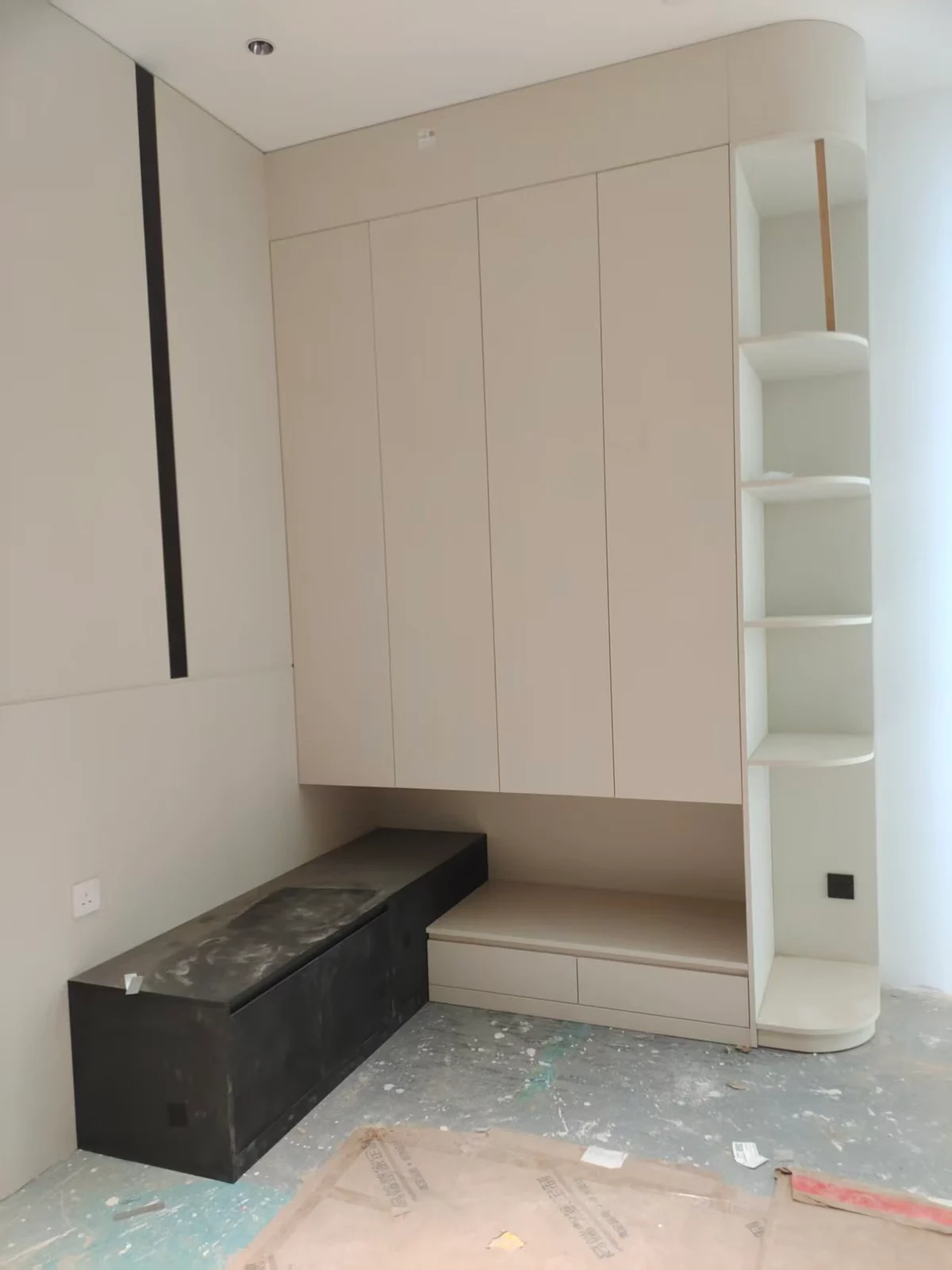 Built-in shelving and a low cabinet during installation
