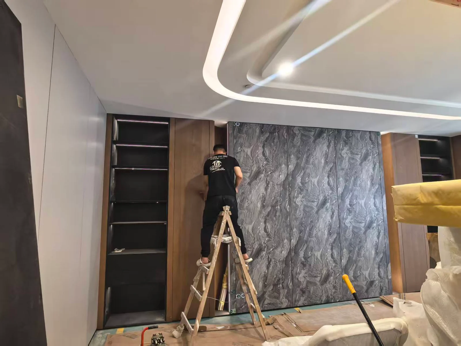Cabinet installation beside a stone-pattern feature wall in Singapore