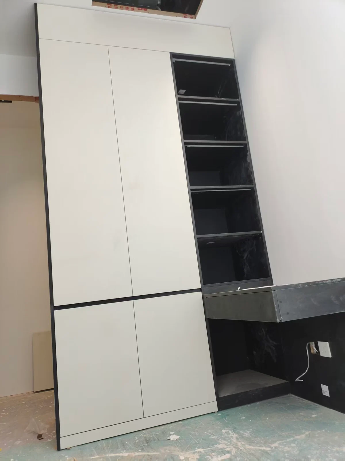 Tall cabinets and open shelves during fitting